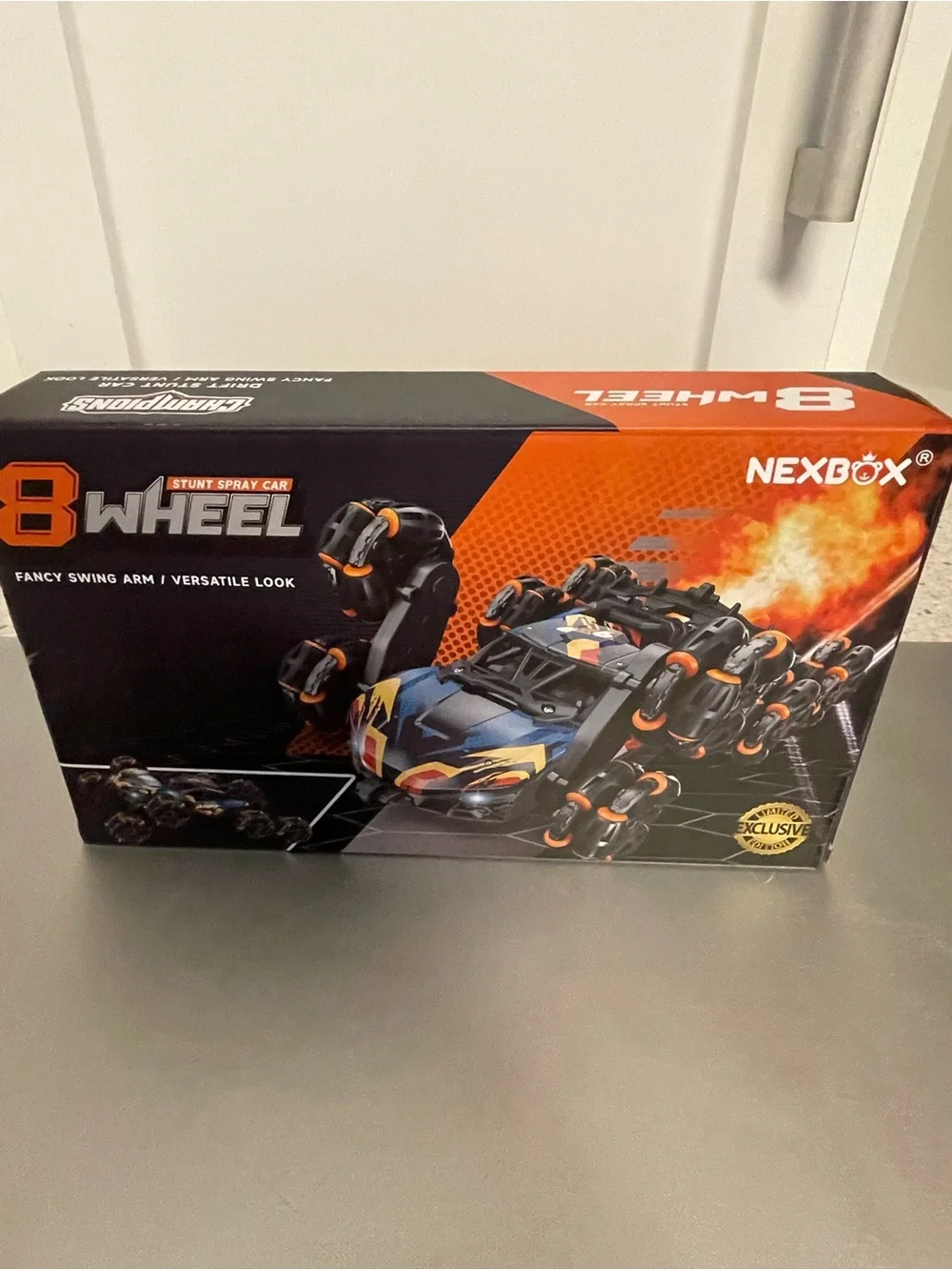 Nexbox 8-Wheel Stunt Spray RC Car - Black with Orange Accent NIP